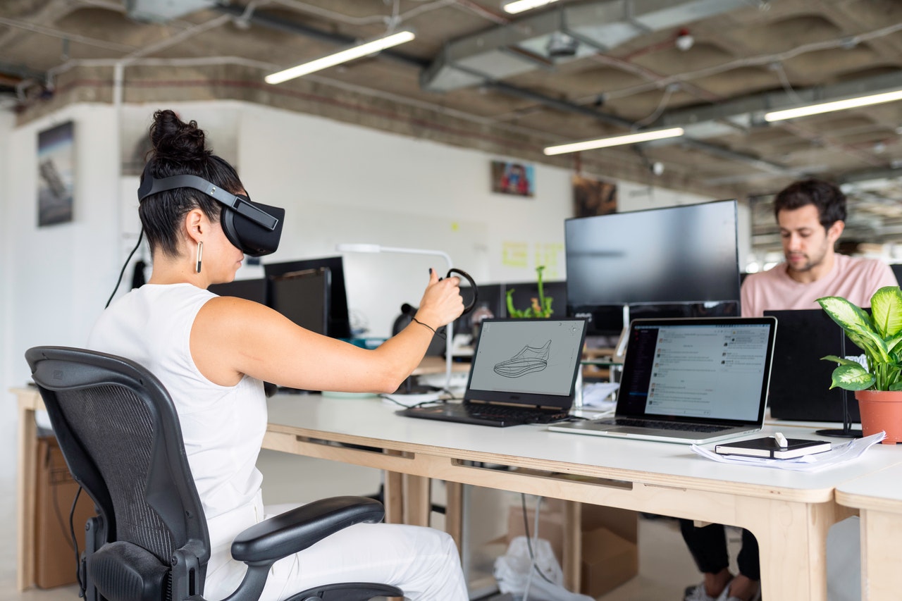 Woman using VR headset for design